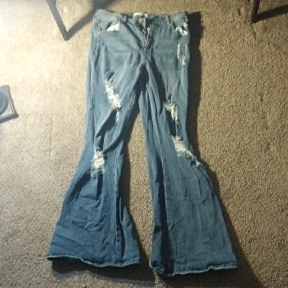 I am selling ripped flare blue rue 21 jeans